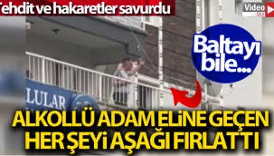 İzmir'de alkollü bir kişi, balkondan esnafa balta fırlattı
