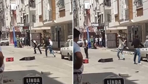 Sokak ortasında bavullu, kaldırım taşlı, sopalı kavga