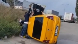 Kamyonun sıkıştırdığı taksi takla attı: 2 yaralı