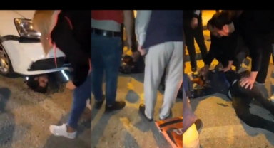 Motosikletli kurye otomobilin altında kaldı