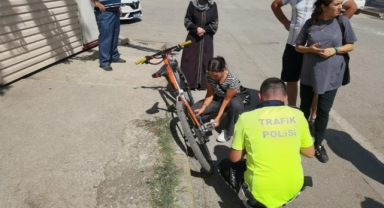 Yaralı halde bisikletini tamir etmeye çalıştı