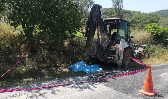 Yol çalışmasını izleyen şahıs iş makinesinin altında kaldı