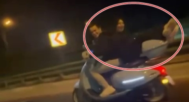 Motosikletin arkasına ters oturup ölüme meydan okudu