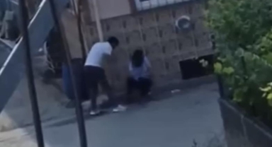 Tartıştığı kadını yol ortasında sürükleyip götürdü