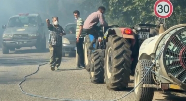 Çiftçiler traktörleriyle yangın bölgesine koştu